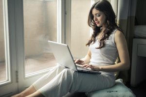 Woman Sitting With a Laptop